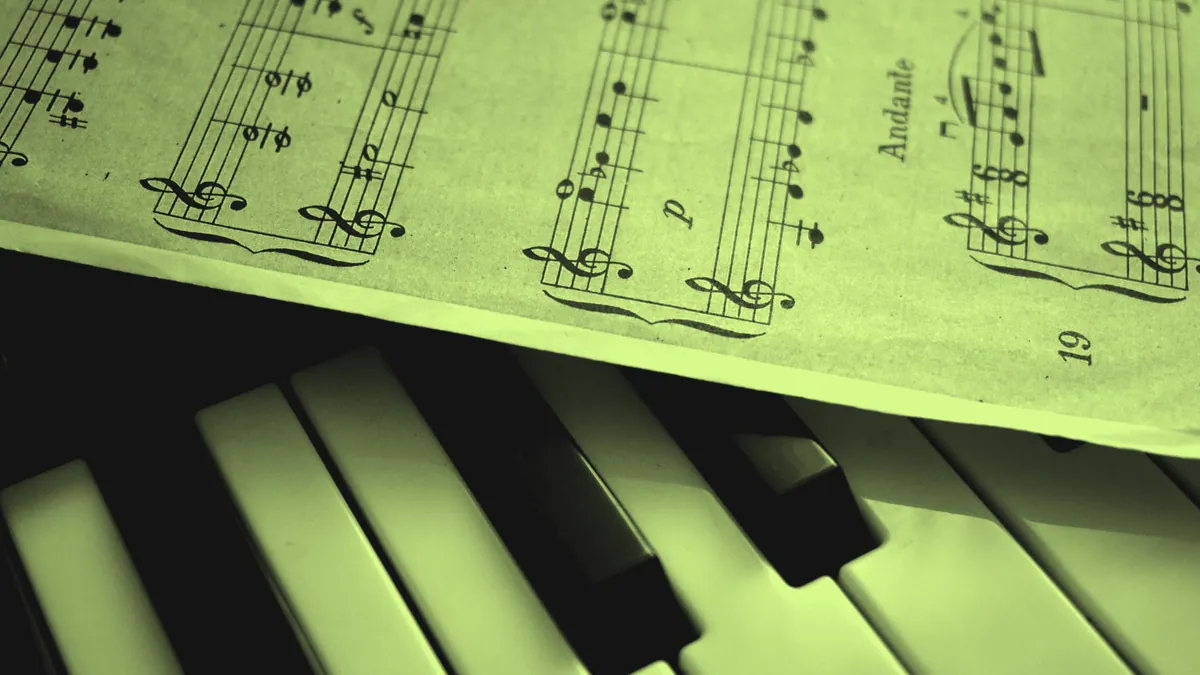 Piano keys and sheet music, where music theory becomes sound.
