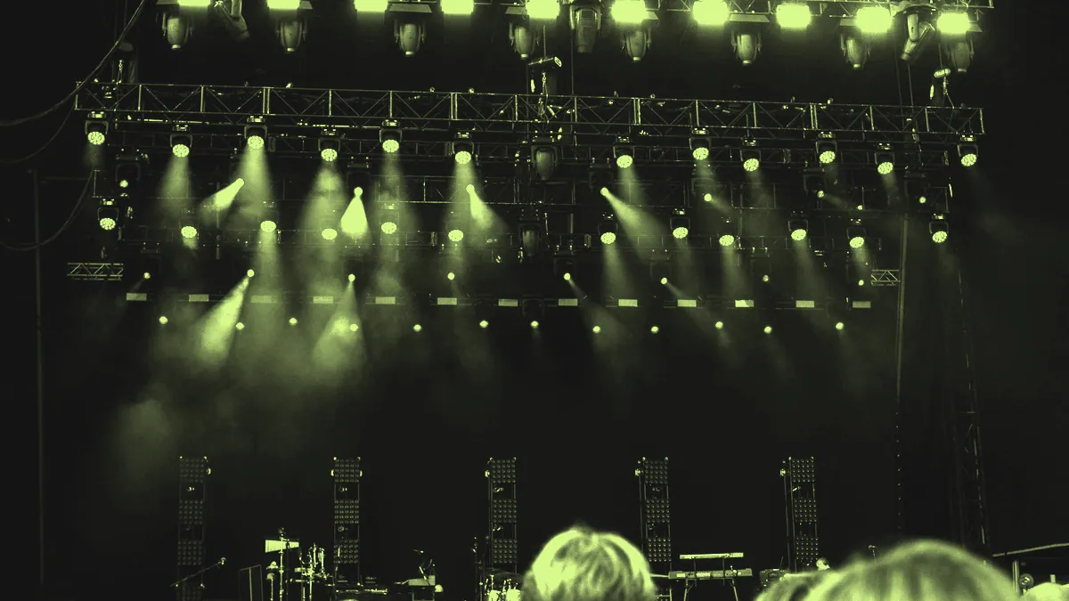 A brightly lit concert stage.